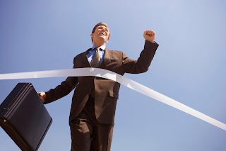 businessman-crossing-the-finish-line-image-by-royalty-free-corbis